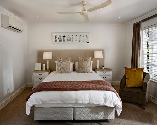 A warm, bright room in Guadalajara with soft curtains diffusing bright daylight beautifully